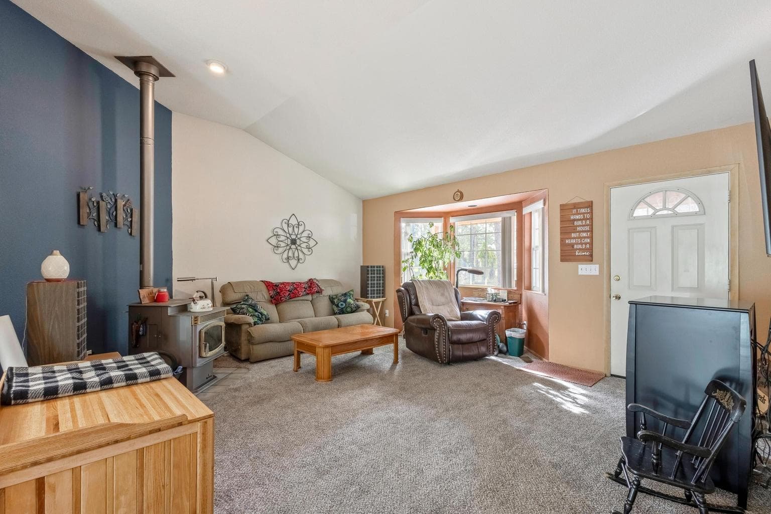 Large living area with new carpet.