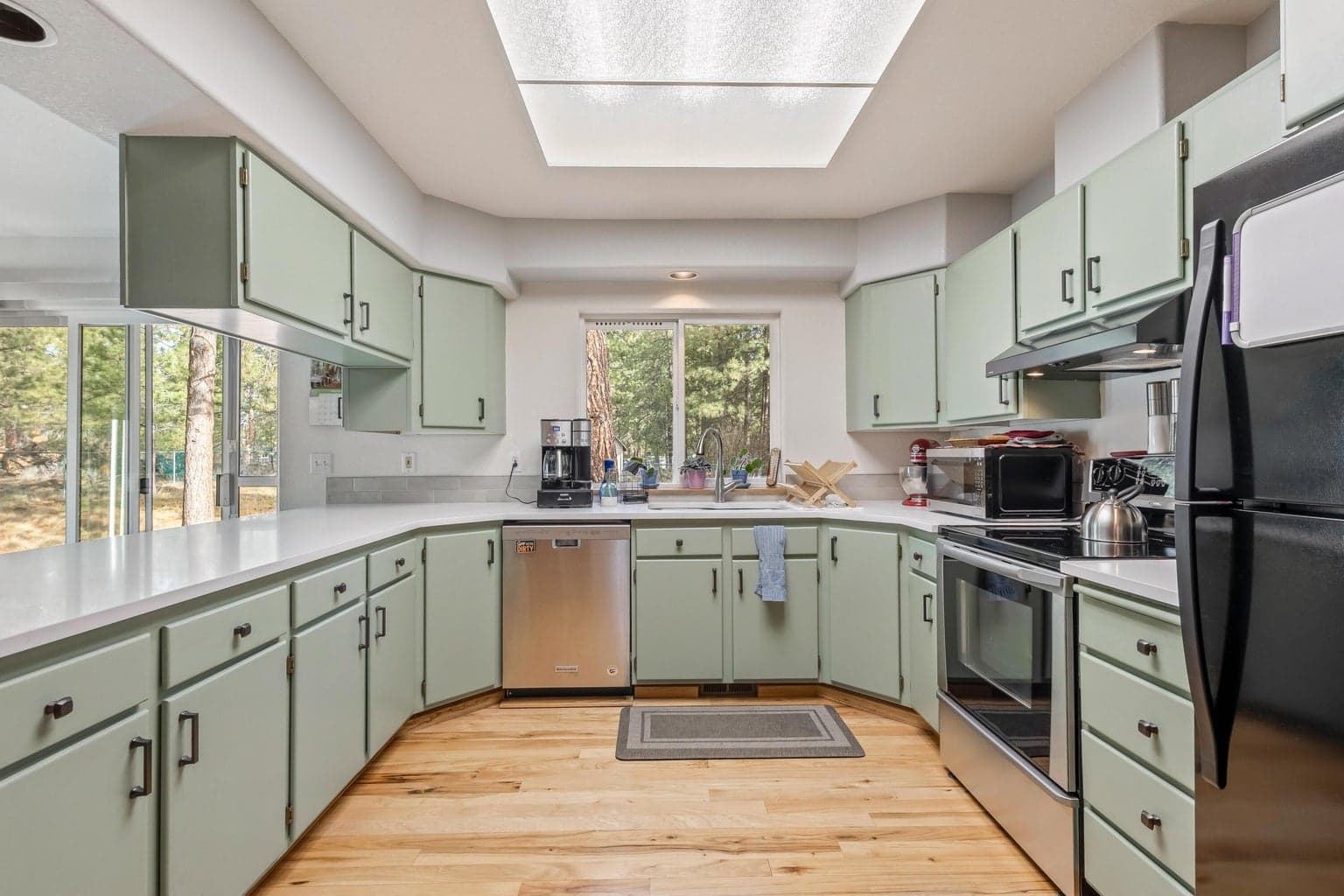 Updated kitchen features new quartz counters.