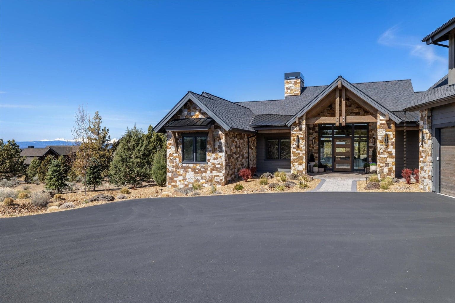 Stone facade, mountain views, welcoming arches