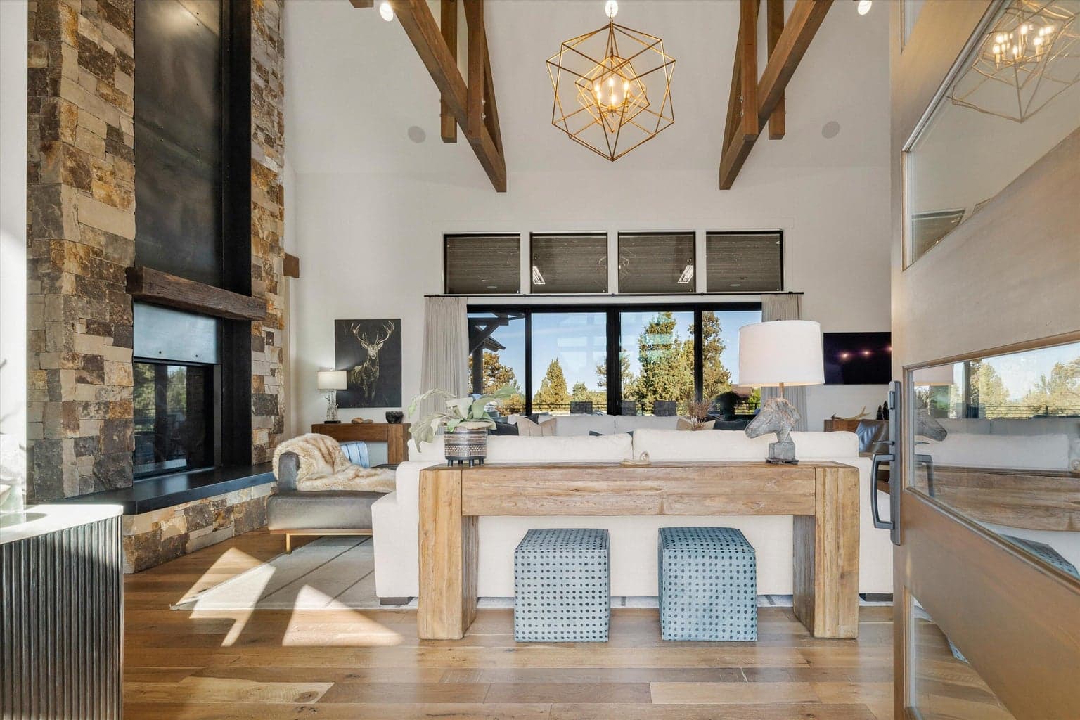 Vaulted ceilings, wooden beams, transom windows optimize natural light
