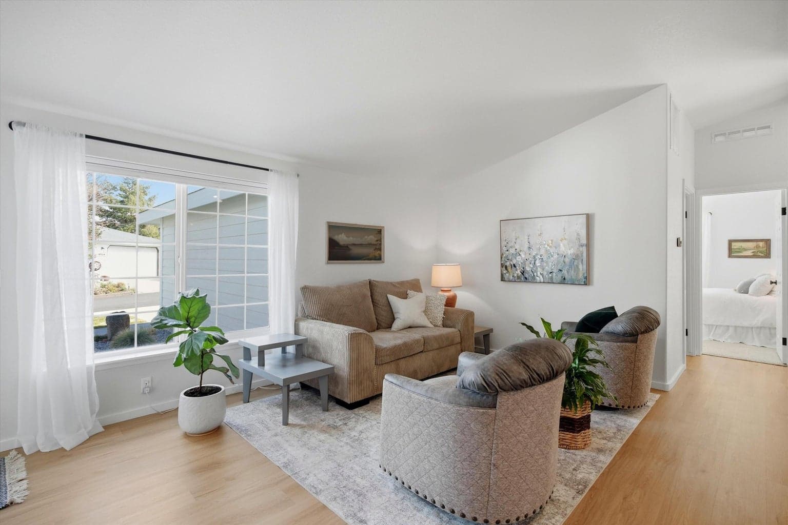 The open floor plan has multiple seating and gathering areas making it great for friends and family.