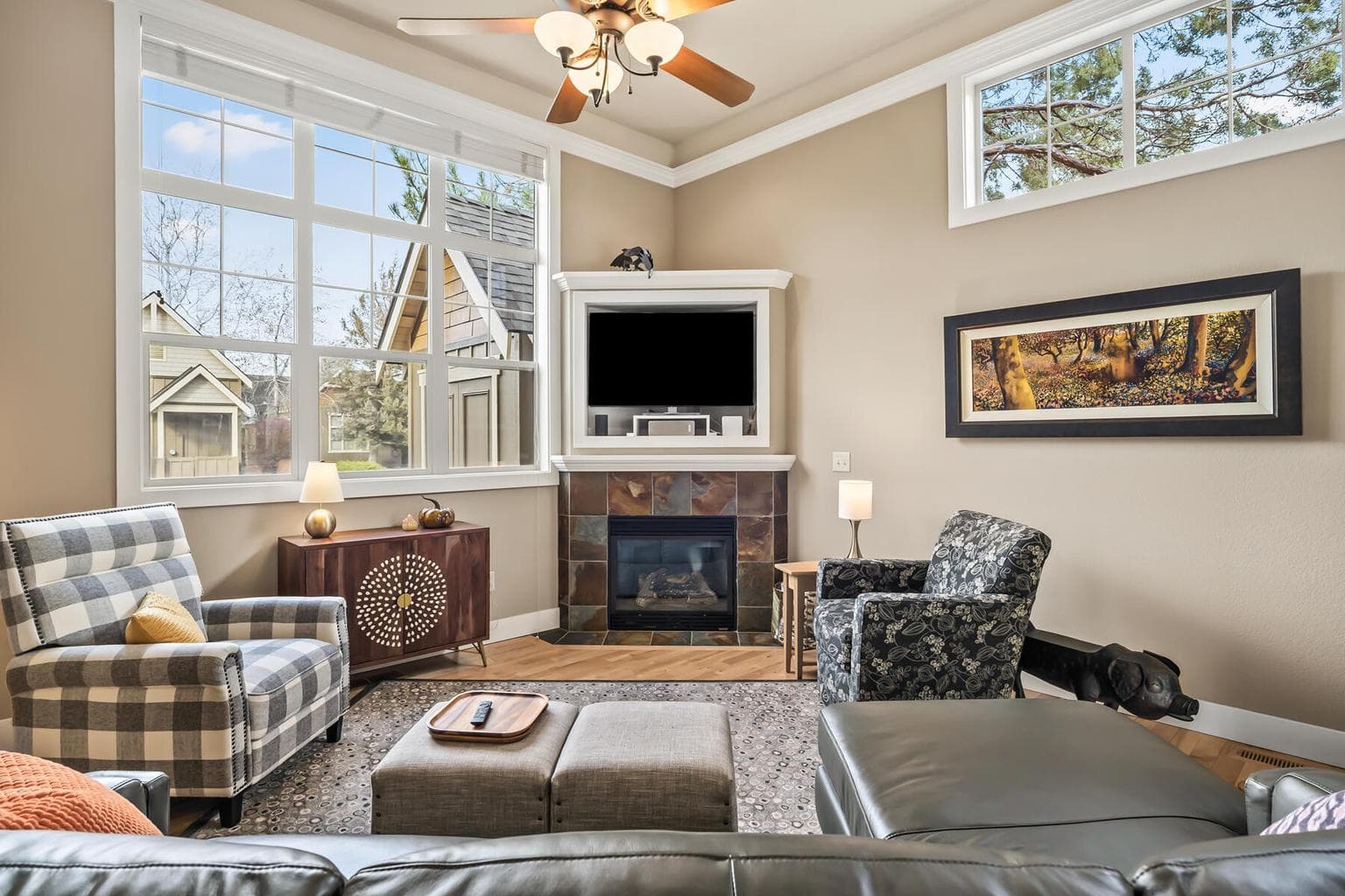 Gather around the fireplace in this warm and inviting great room