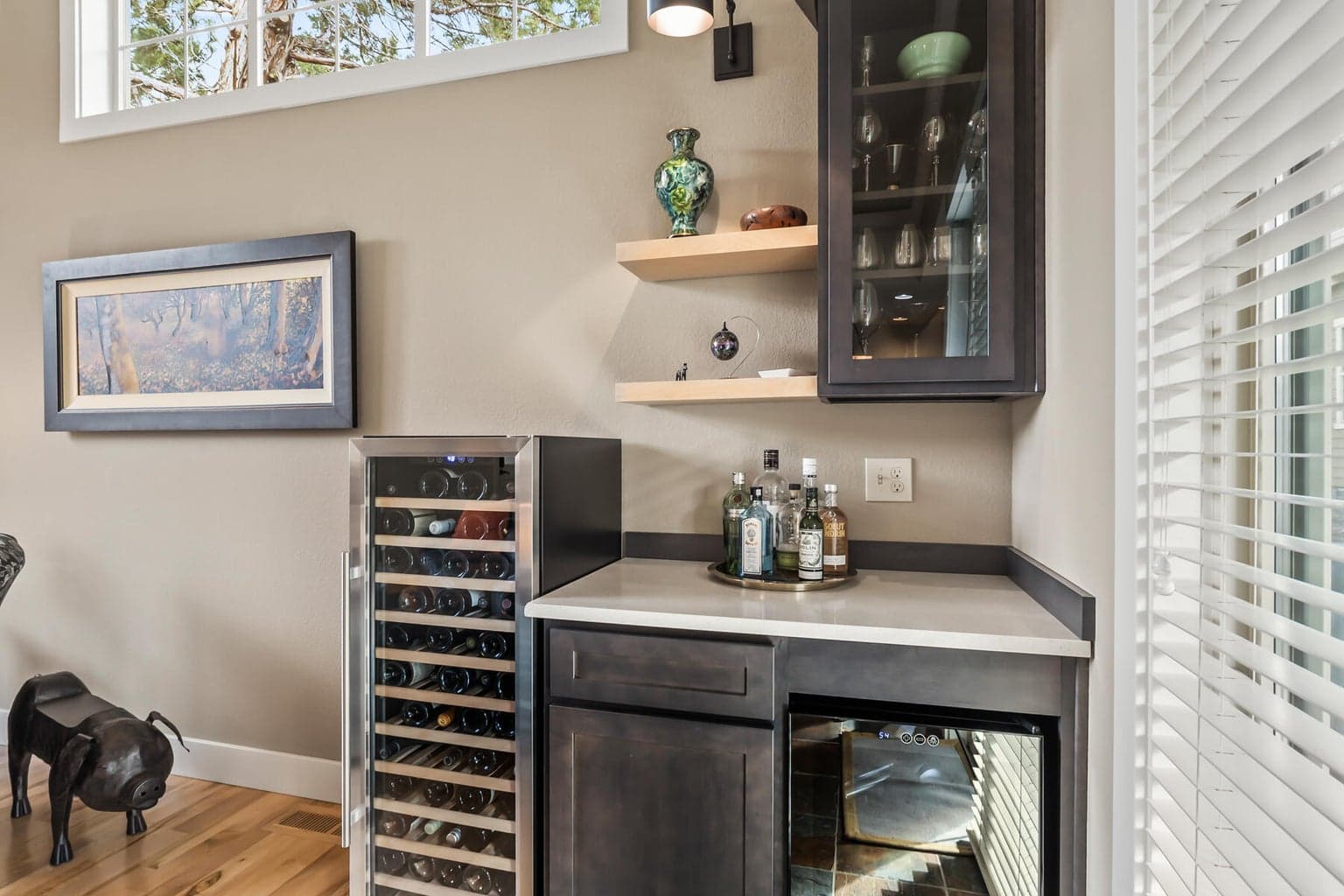 Dedicated dry bar with mini fridge and custom built-in cabinetry — perfect for post-trail happy hours