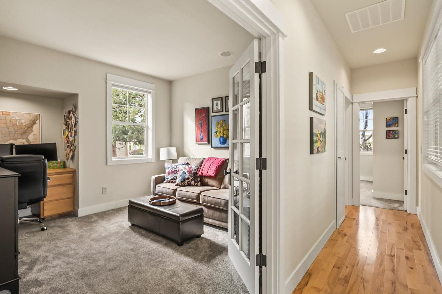 Wide, light-filled hallways connect this thoughtfully designed single-level craftsman