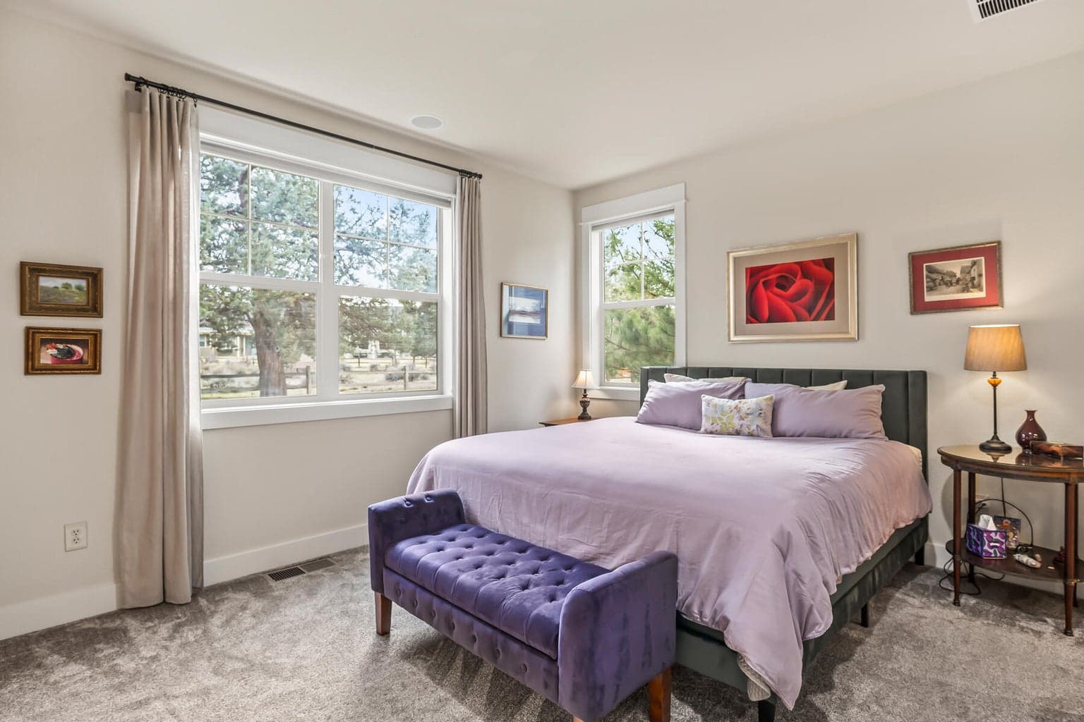 Nature is your backdrop in this beautifully positioned primary bedroom