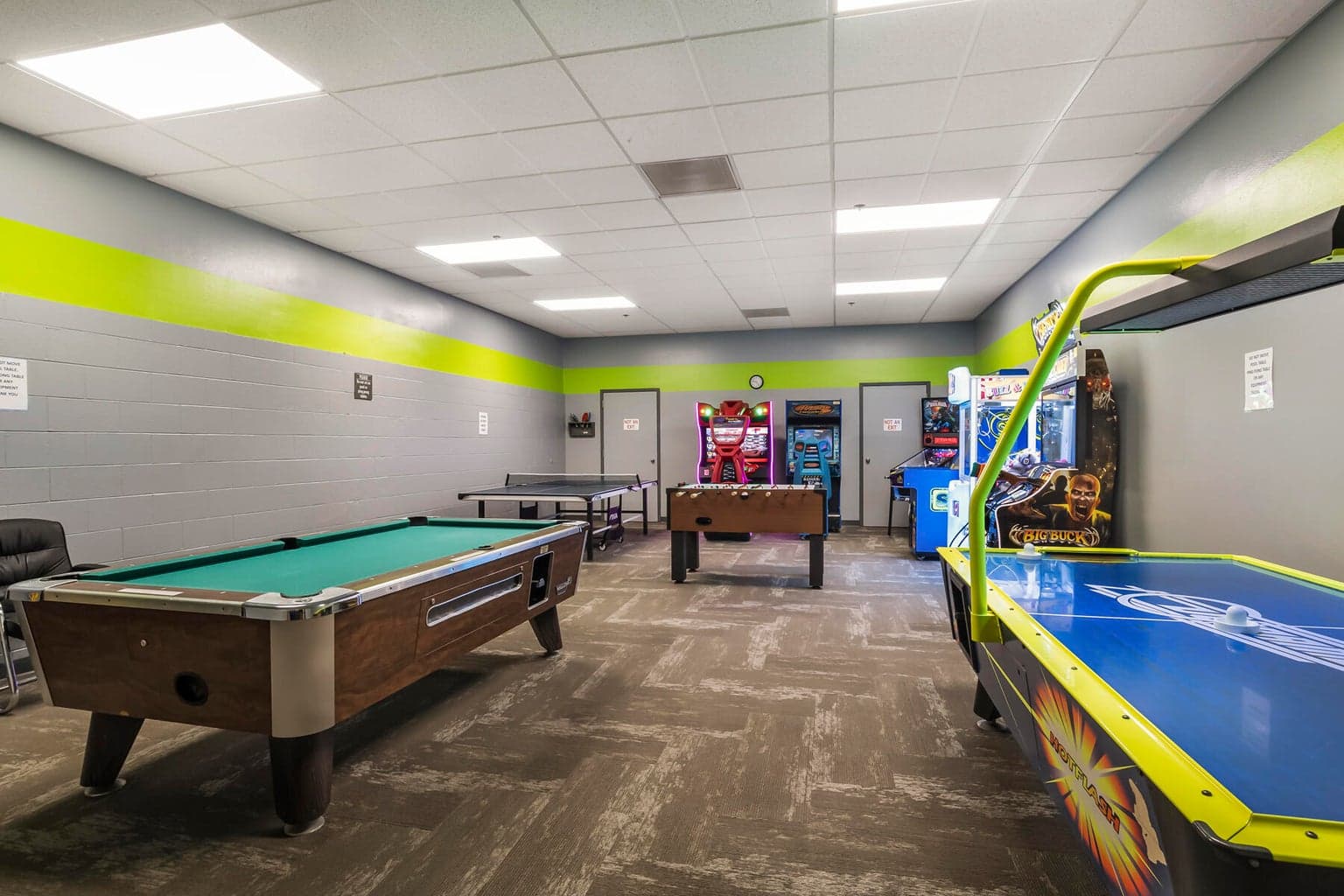 Game room complete with pool table, ping pong, foosball, air hockey, and arcade games
