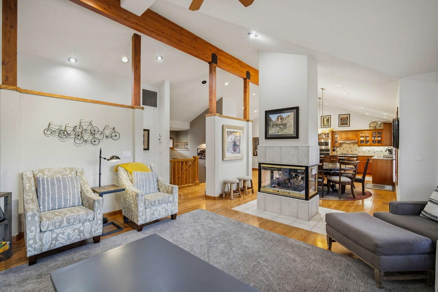 Vaulted ceilings and a cozy double-sided gas fireplace.