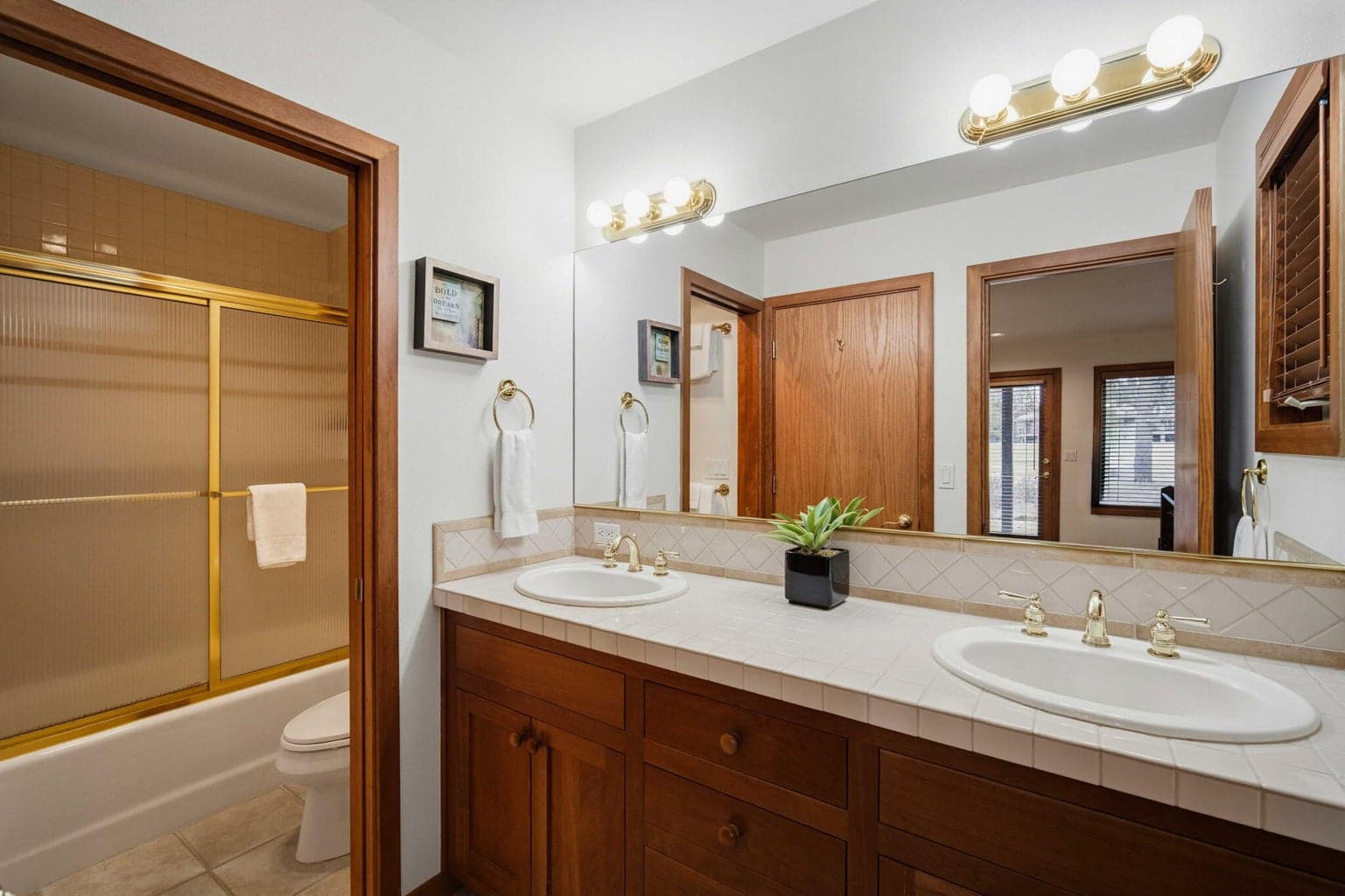 Bathroom attached to bedroom #3 and also a door in the hallway.
