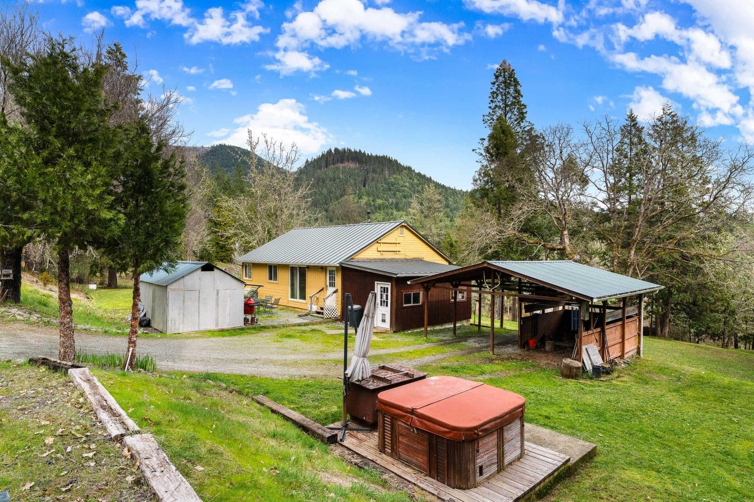 View of Home, Tin Shed, Carport, Wood shed and Jacuzzi