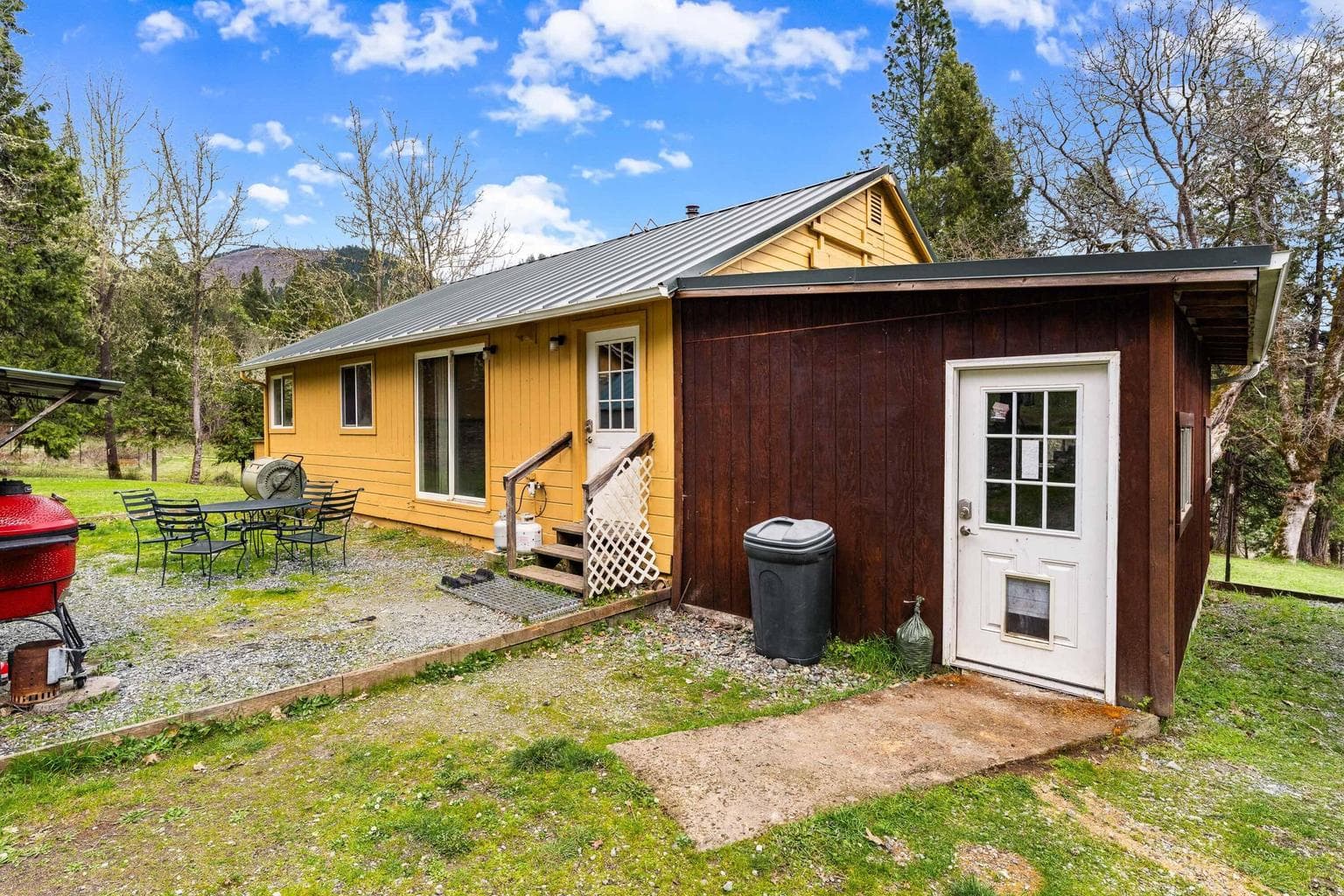 View of Home with Attached Utility Room
