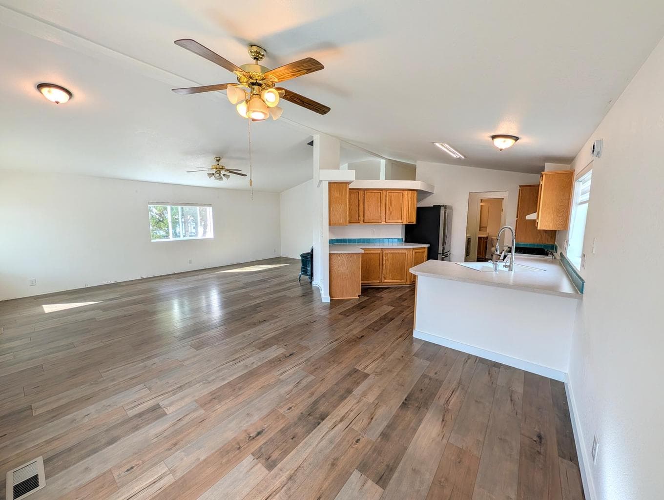 Large open living area with newer floors.