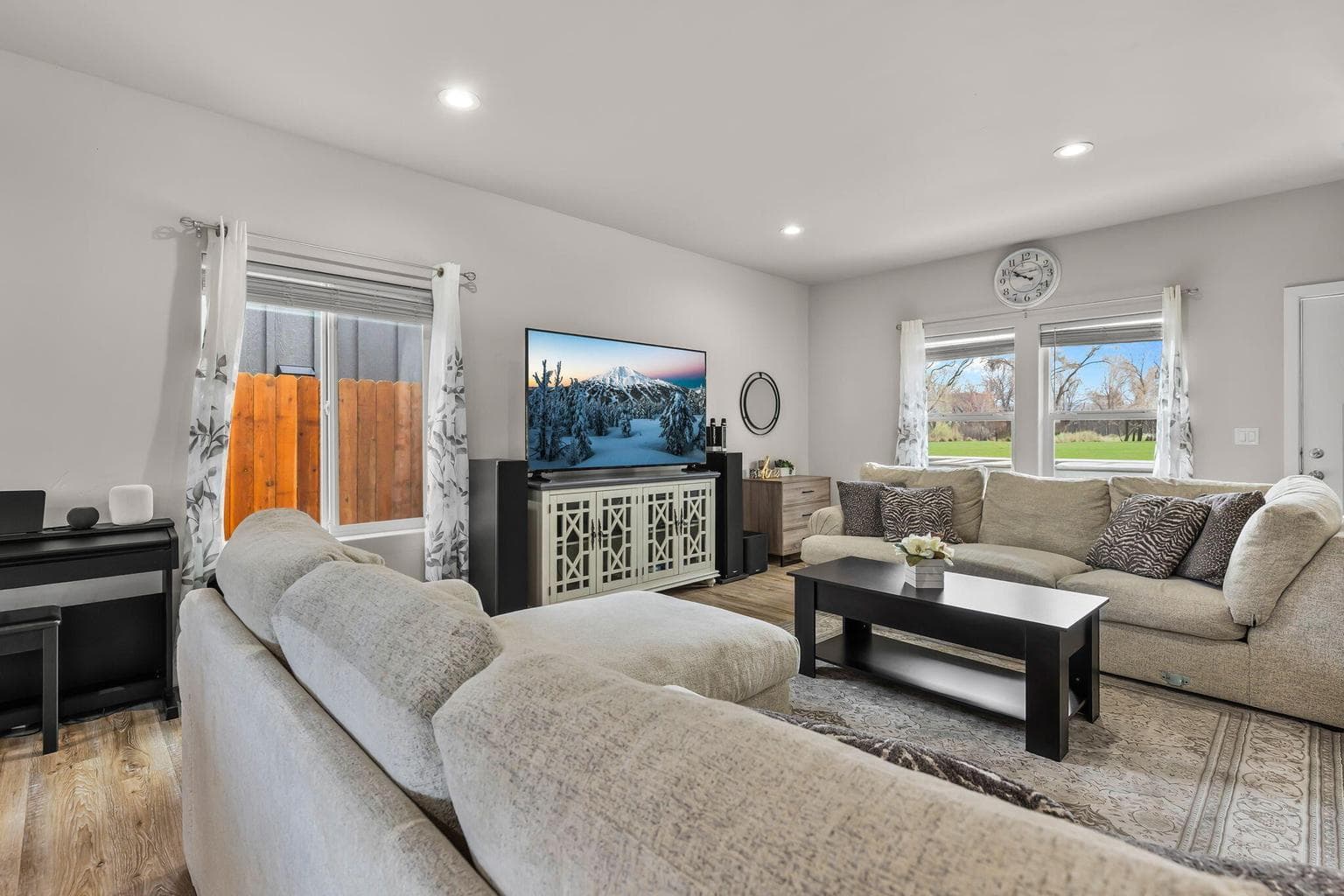 Open-concept living area with large windows for natural light.