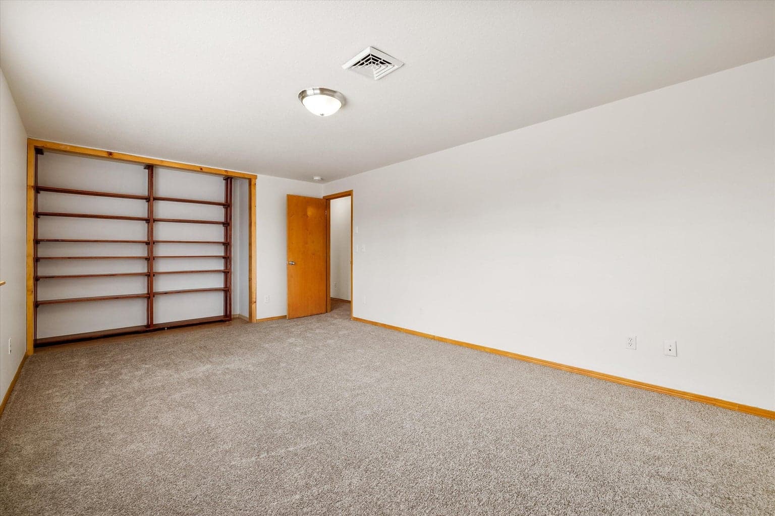 Large bedroom used as a big sunny office.