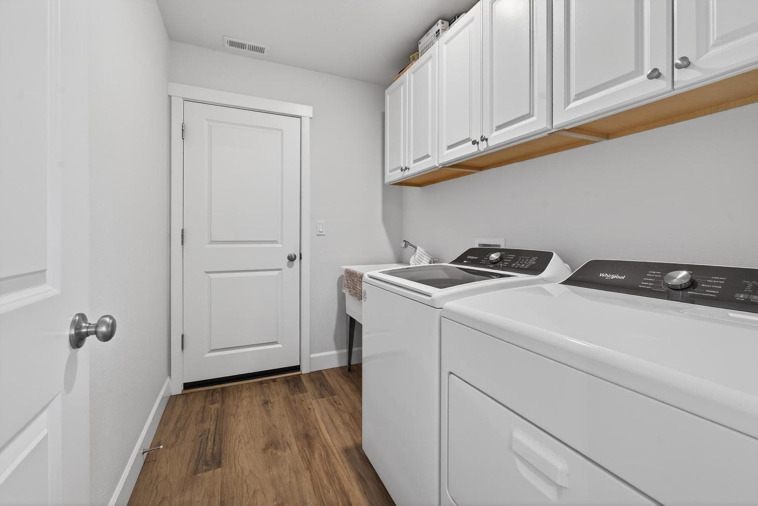 Laundry Room, built in cabinets & garage access