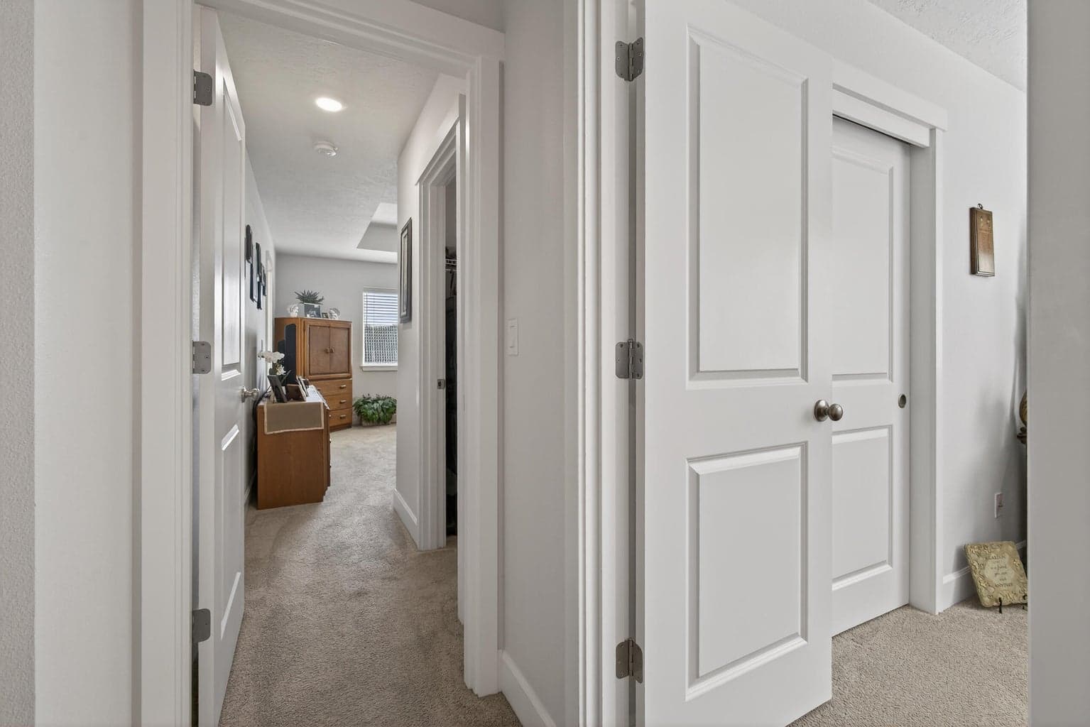 Bedroom 2 on the right and entry to primary Bedroom in front