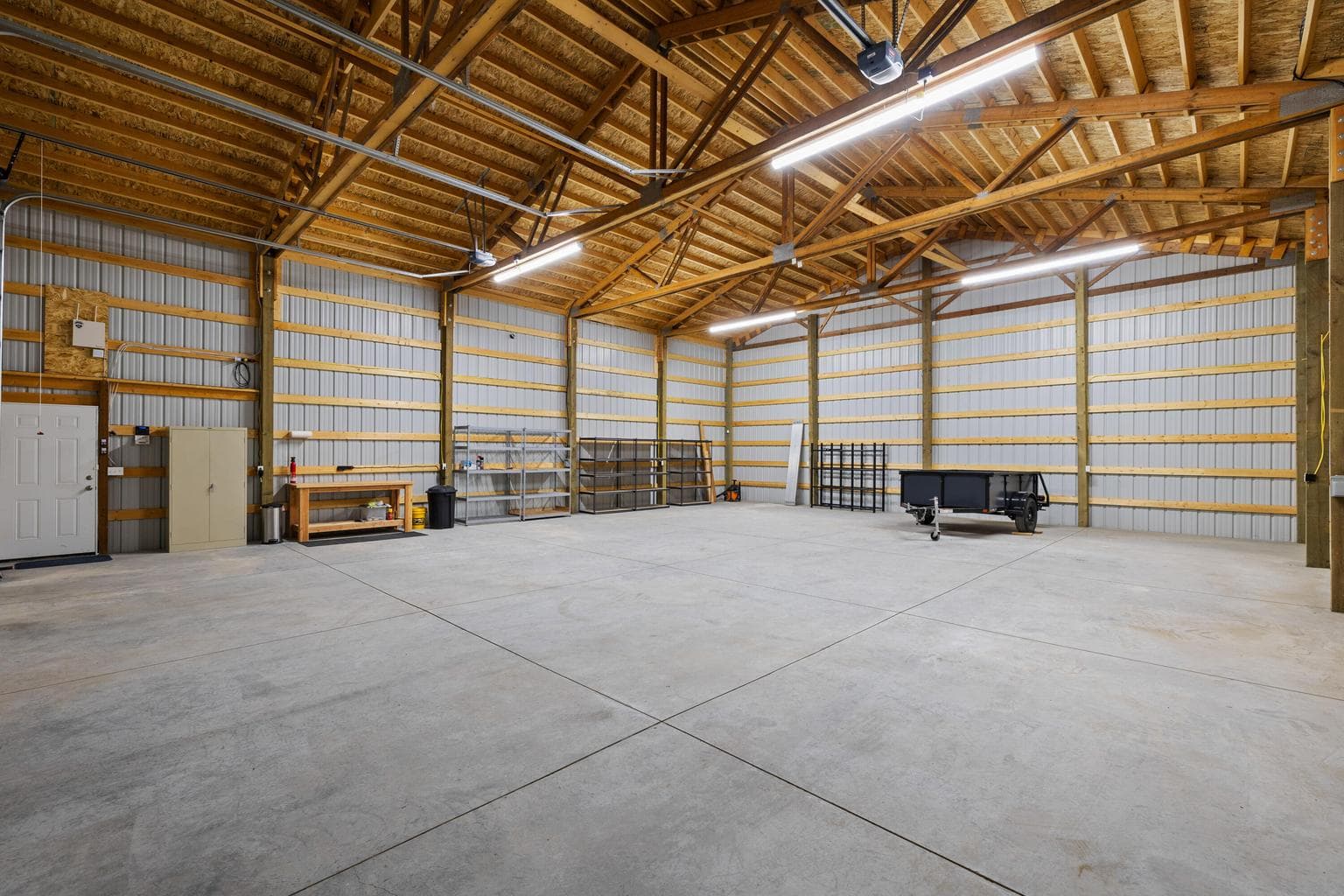 This sale includes a utility trailer, storage shelving and even some tools that are useful on the property.
