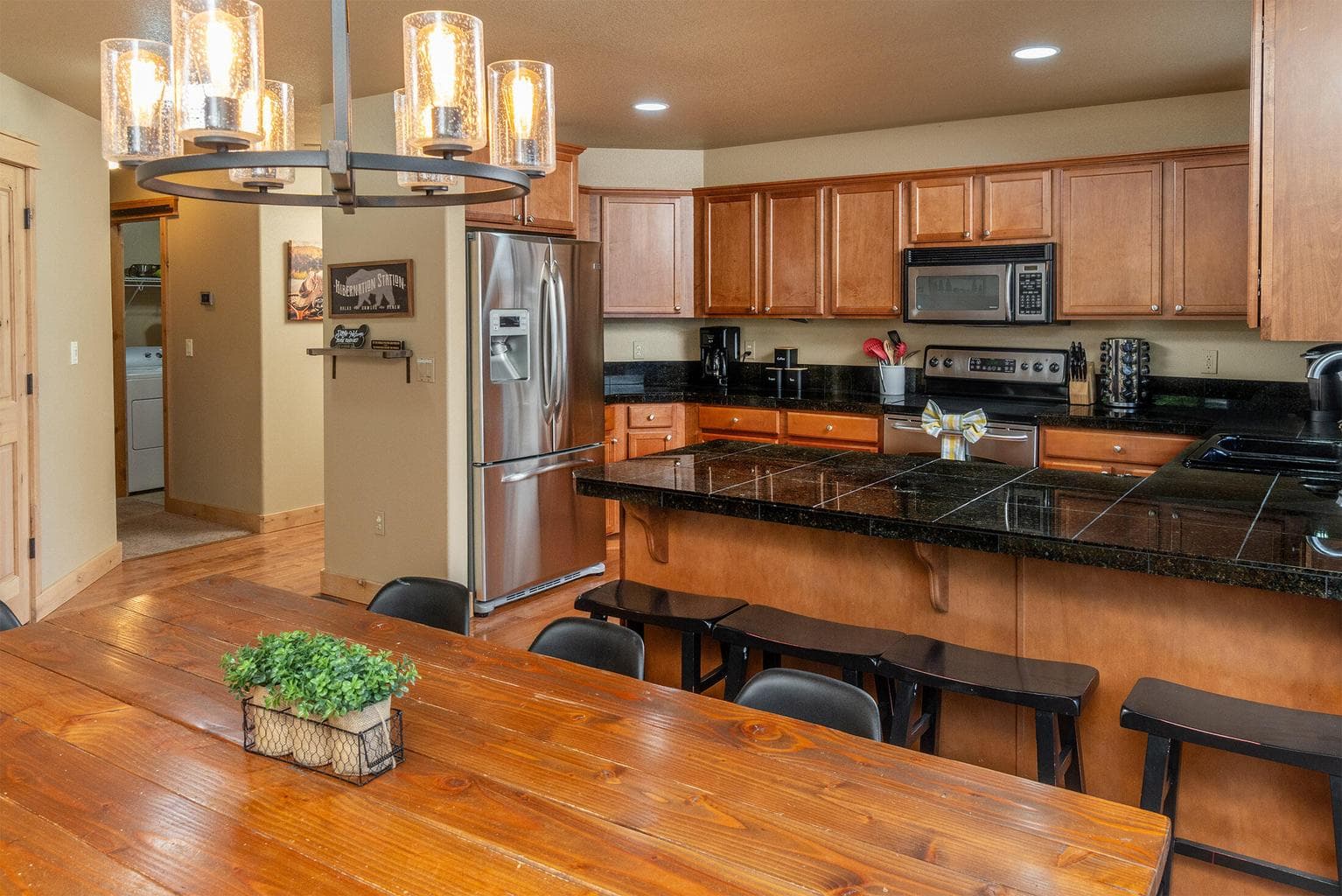 With Stainless Steel appliances, breakfast counter & spacious table area.