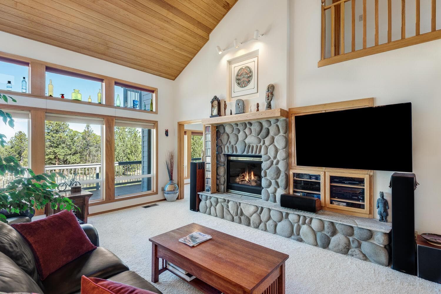 Living room w/gas fireplace & vaulted ceilings