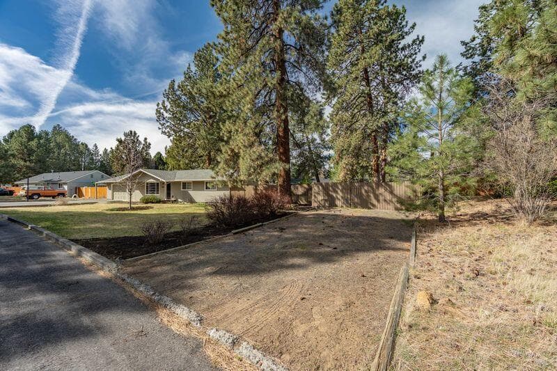 Second driveway on the other end of the property, perfect for RV/Boats or future ADU parking.