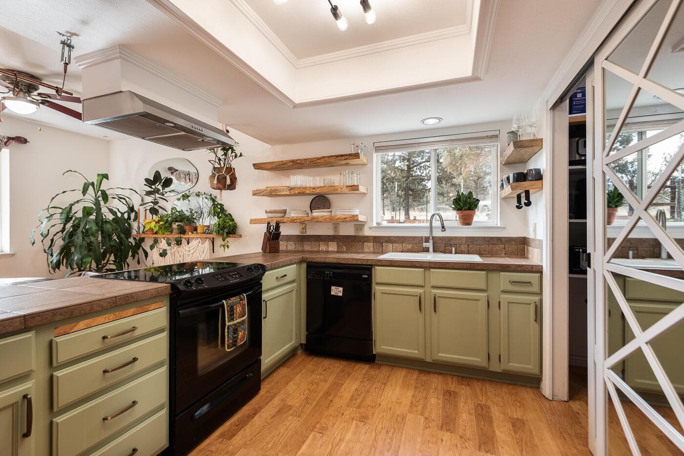 Open kitchen with plenty of counter space and to the right the pantry access