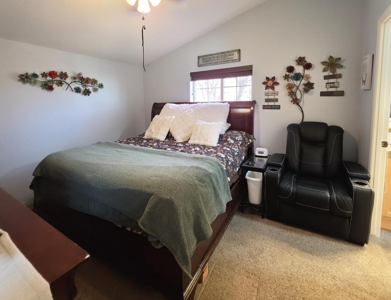 Primary bedroom with vaulted ceilings