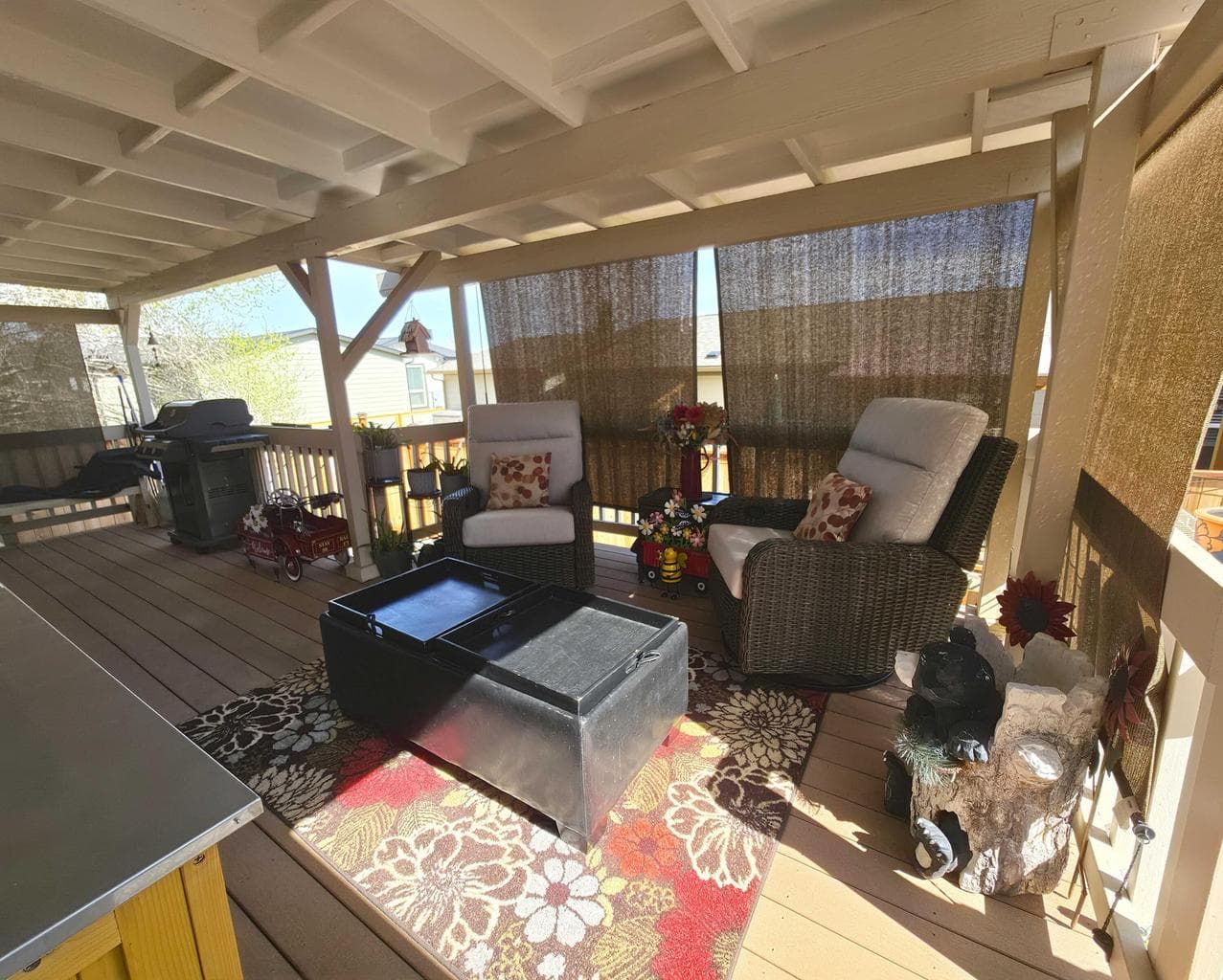 Back deck has shades for sun/wind protection and privacy.