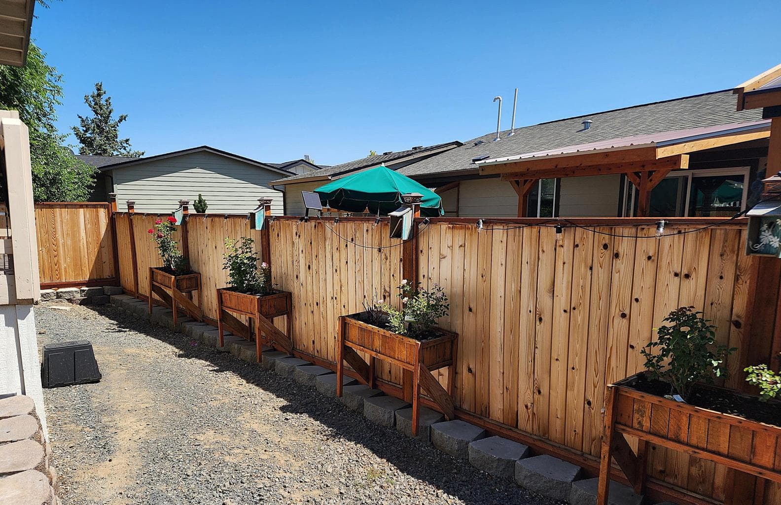 Newer privacy fence encloses back yard