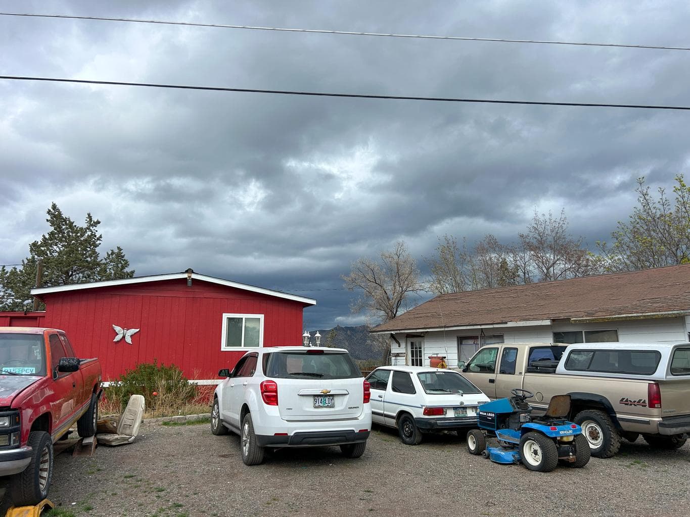 View of the side of the home highlighting the RV parking space and detached garage.