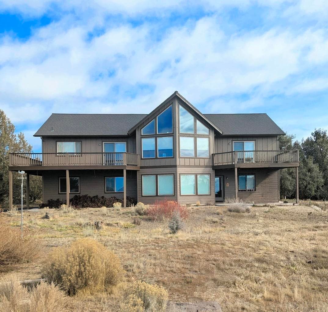 Striking front elevation with modern rustic charm, welcoming curb appeal, and a design that blends beautifully with the natural surroundings.