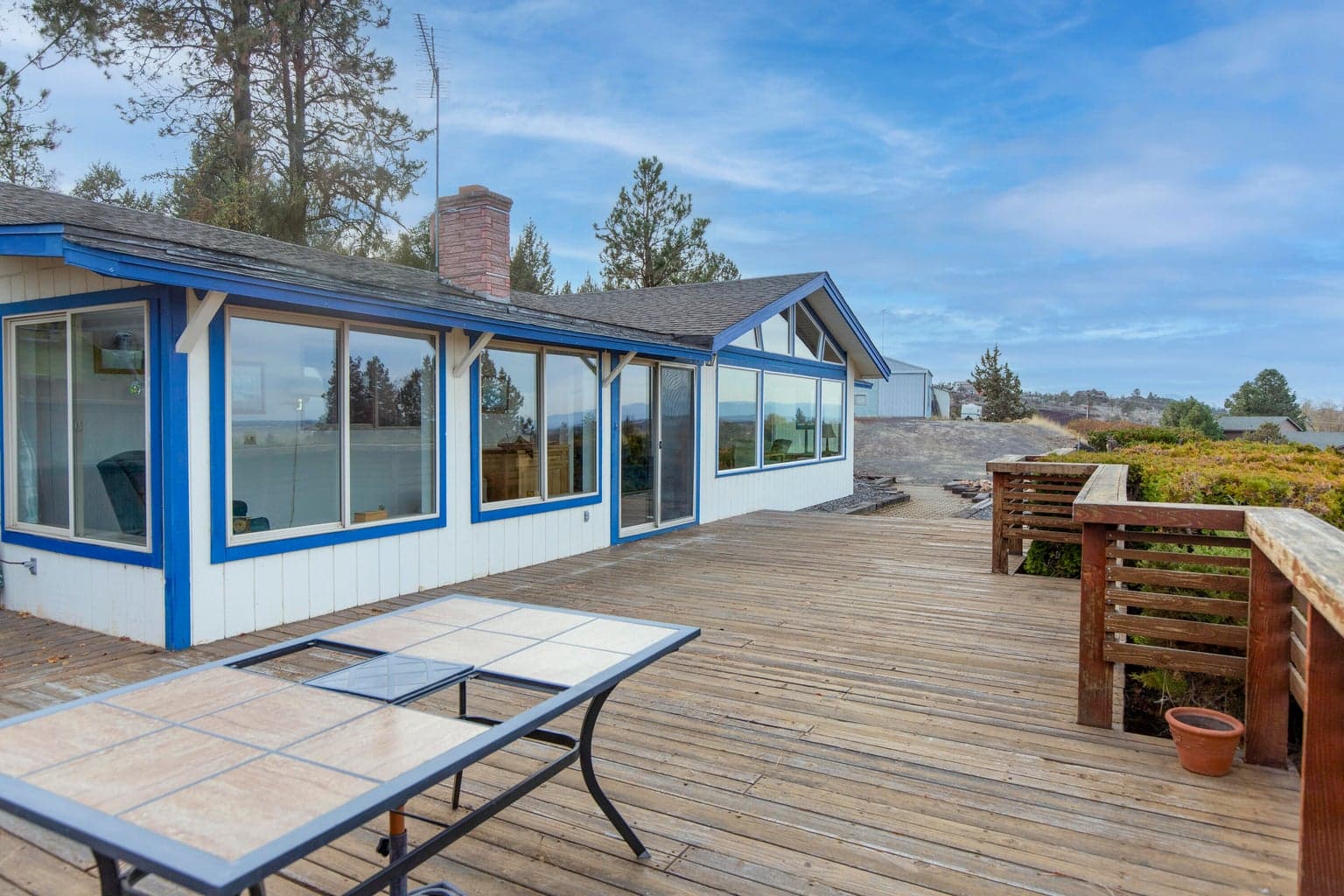 Redwood deck and Sunroom give a view of the mountains