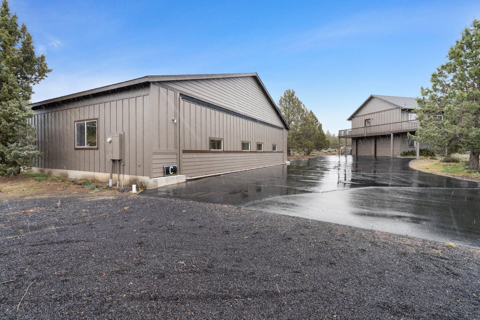 Large shop/garage space offers excellent flexibility for vehicles, storage, hobbies, or recreational gear.