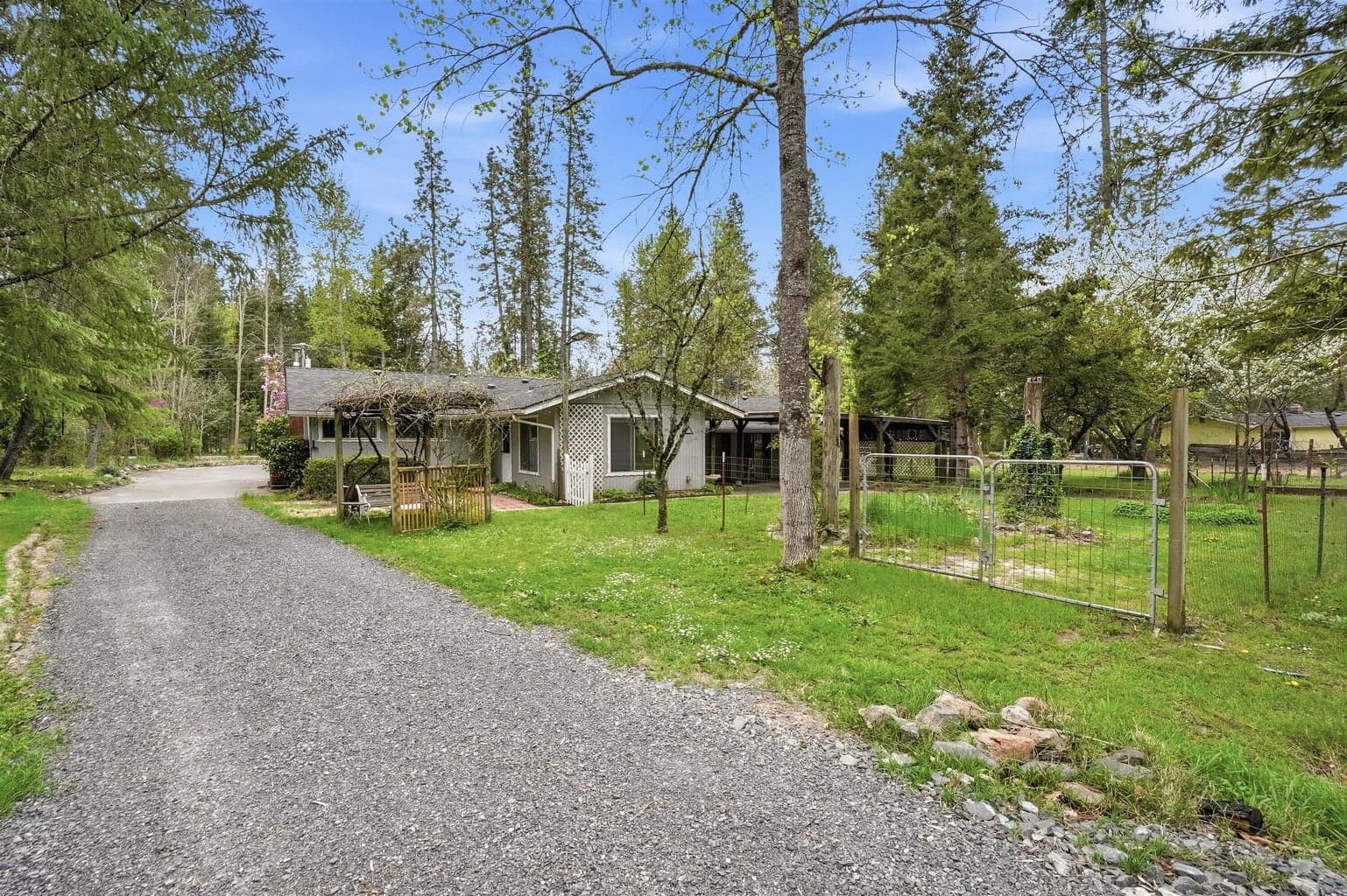 View of the house from the road leading to the back of the property.
