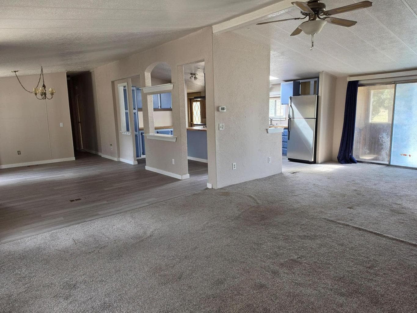 living area, dining and kitchen