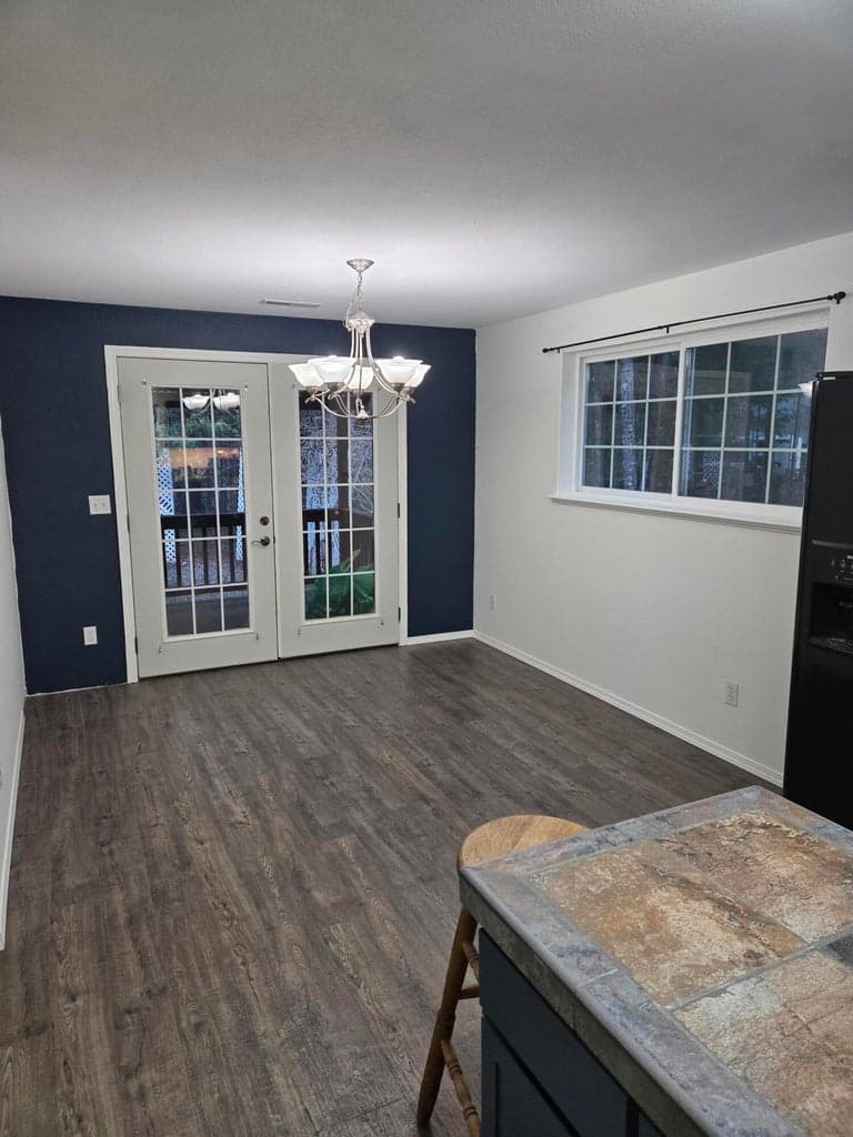 Eating area off Kitchen. French Doors to the covered deck and backyard.