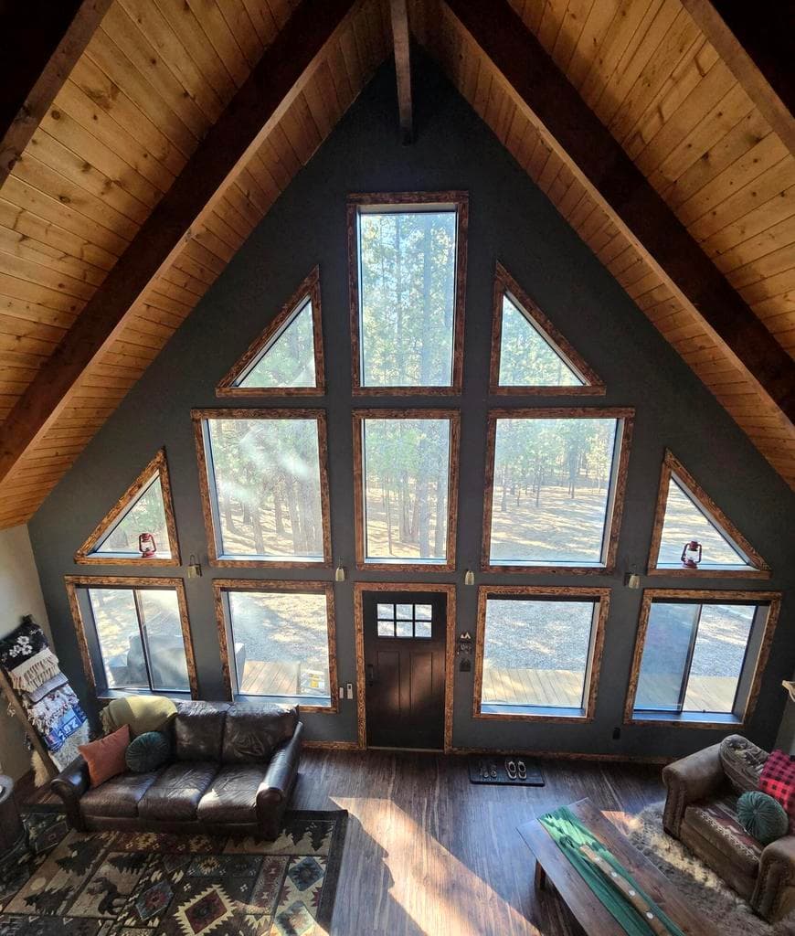 floor to ceiling window with motorized blackout blinds. Provides plenty of natural lighting.
