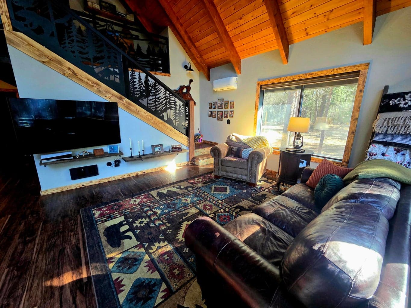 open floor concept on the main floor with upper loft/family room. Note: the custom railings.