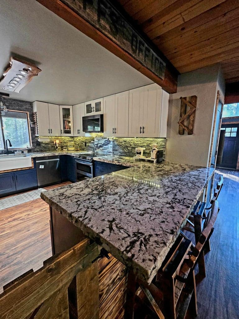 Kitchen is designed to cook in with custom granite countertops