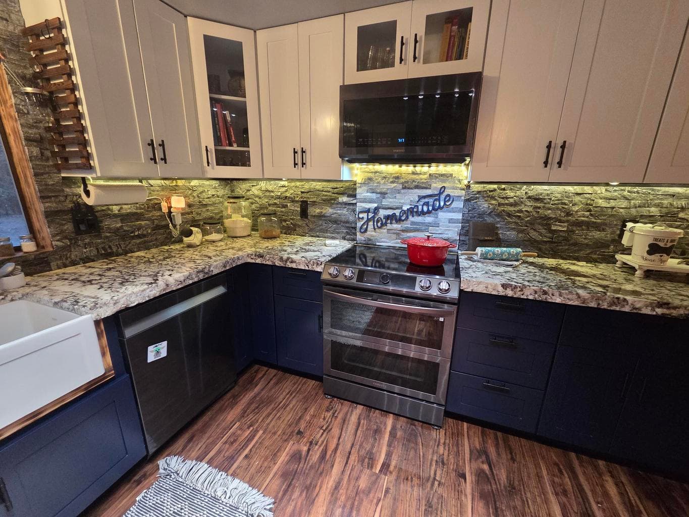 built in range and microware/with vent system. undercounter lighting.