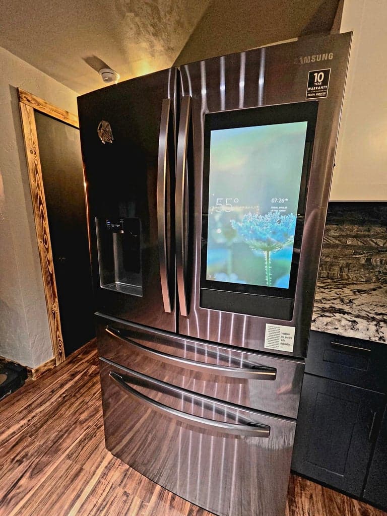 refridgerator has bluetooth accessibility in the door. Can even connect the TV to view it on it.