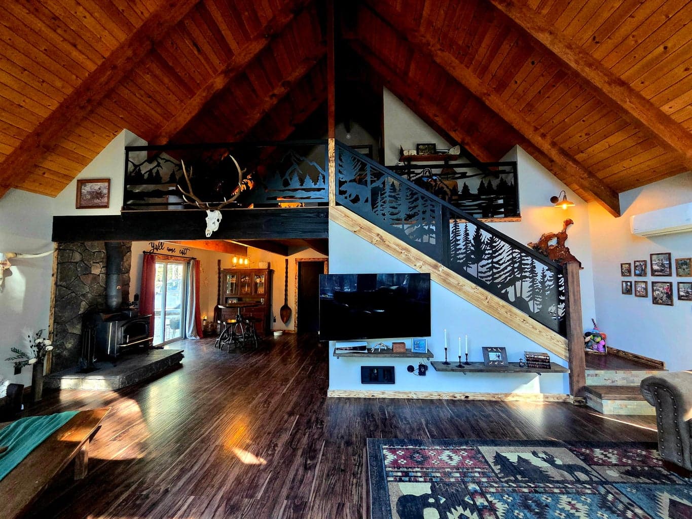 view looking from living room area back at the dining area. NOTE custom design and built locally handrail/panels