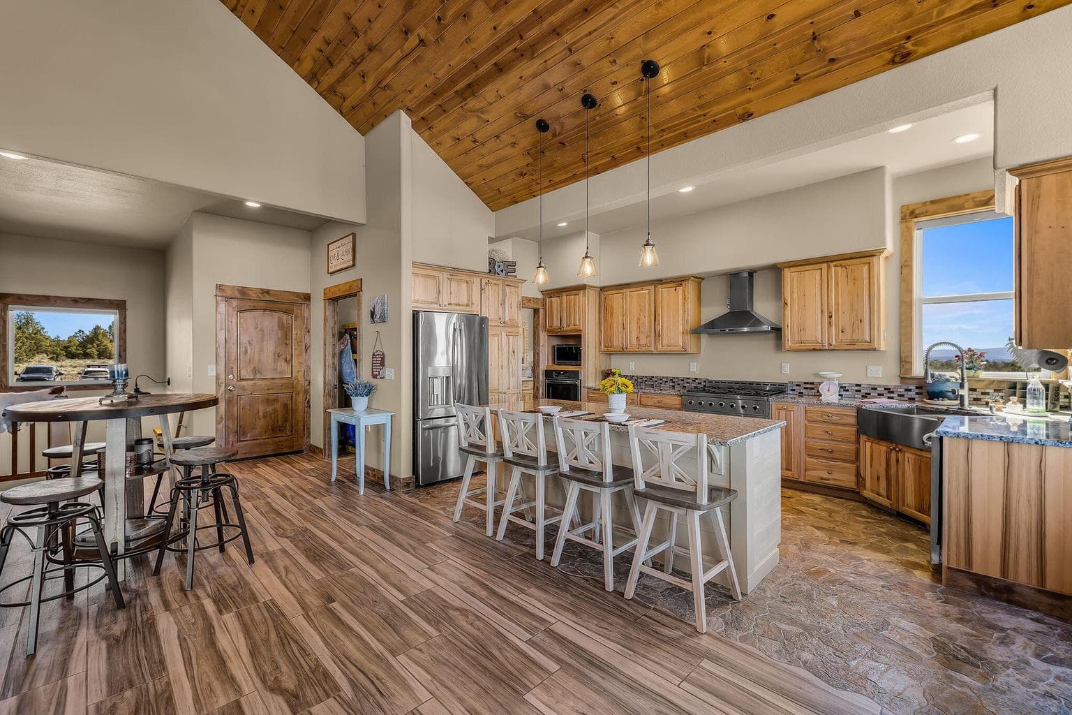 Spacious kitchen with oversized island, SS appliances, propane range - plenty of space for entertaining family & friends!