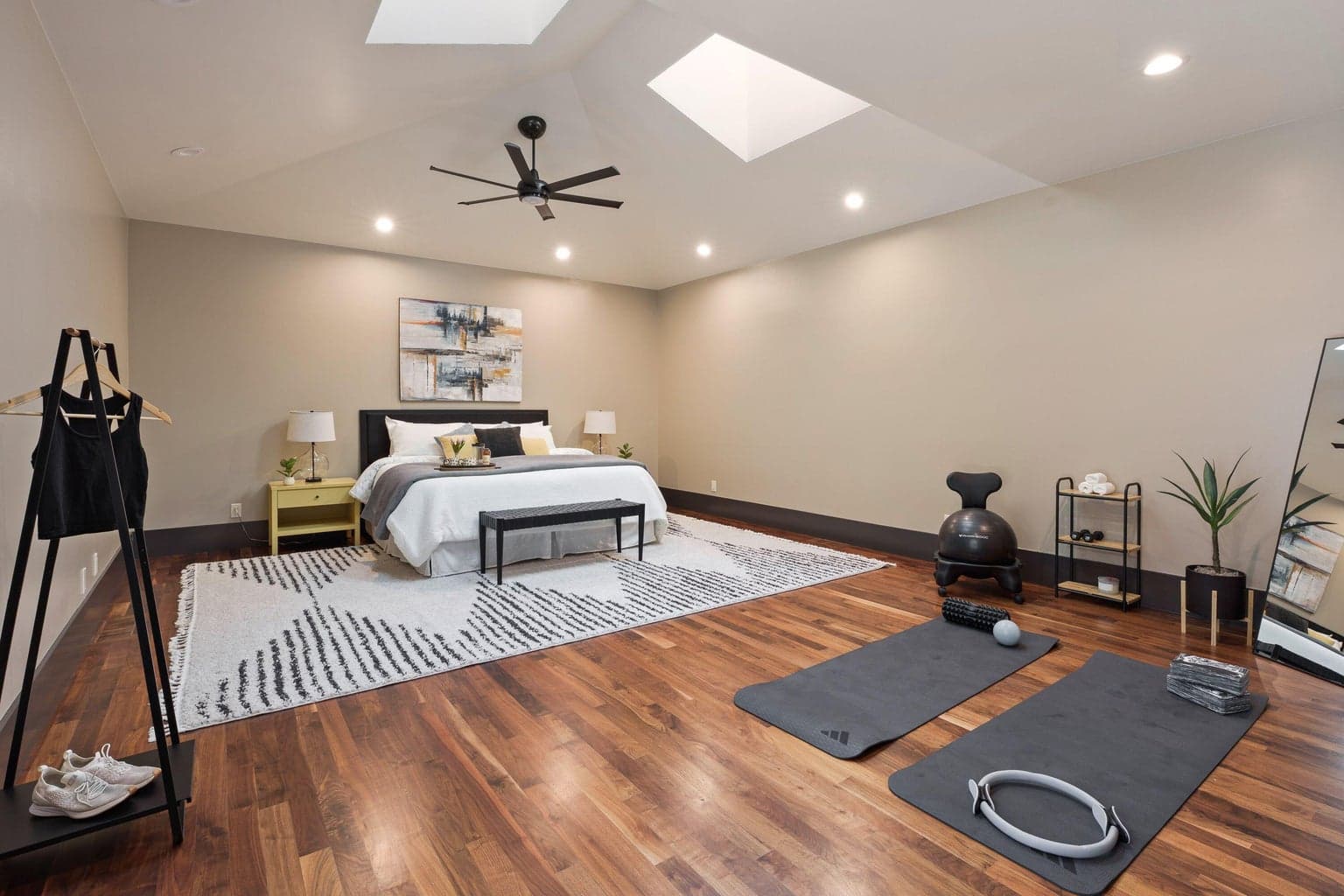 Versatile home studio or guest suite with vaulted ceilings and skylights, ideal for guests, fitness, or a home office.