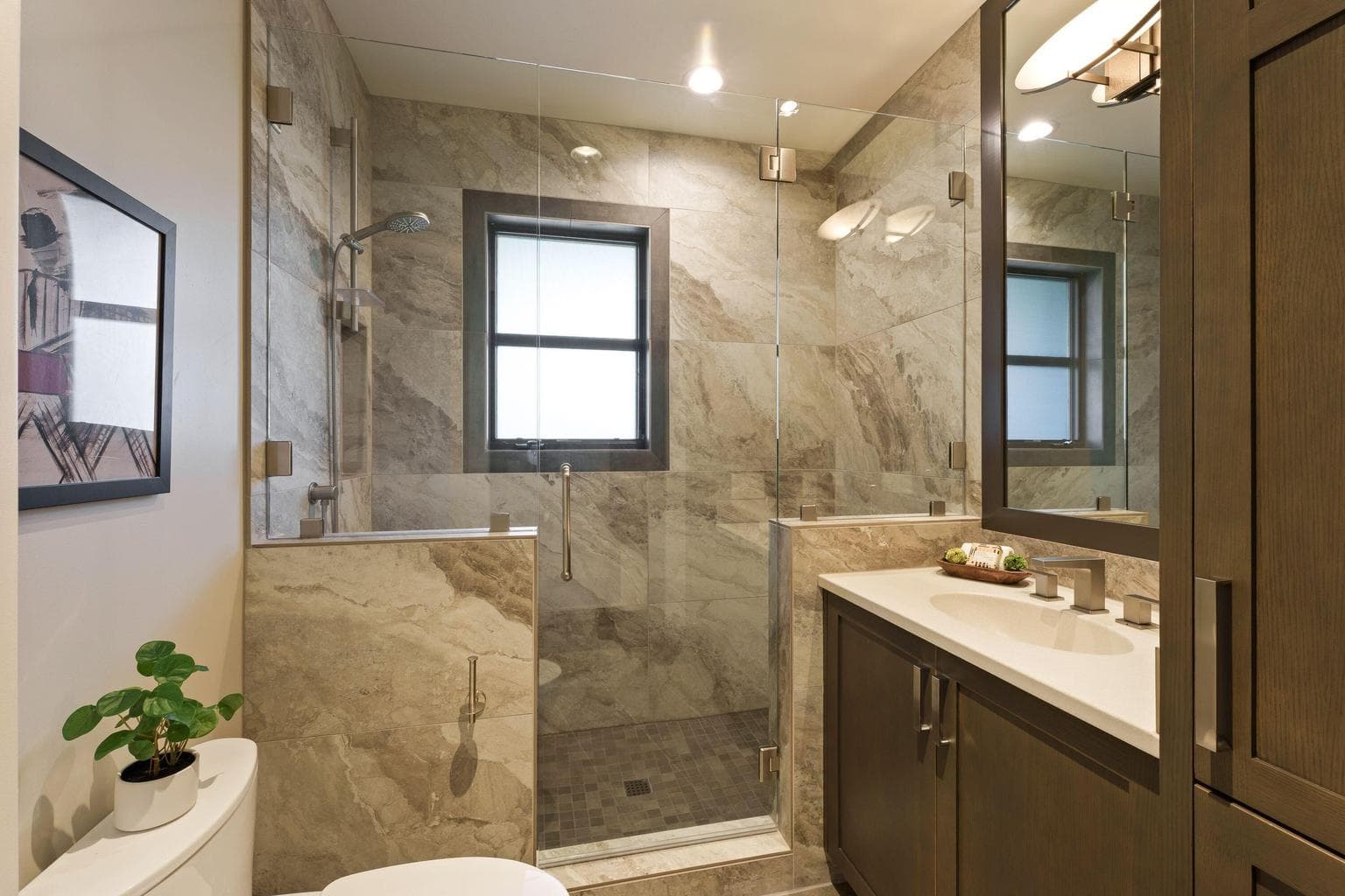 Fourth full bath located near the mud room—ideal for guests or post outdoor activities, featuring a walk-in tiled shower and clean, modern finishes.