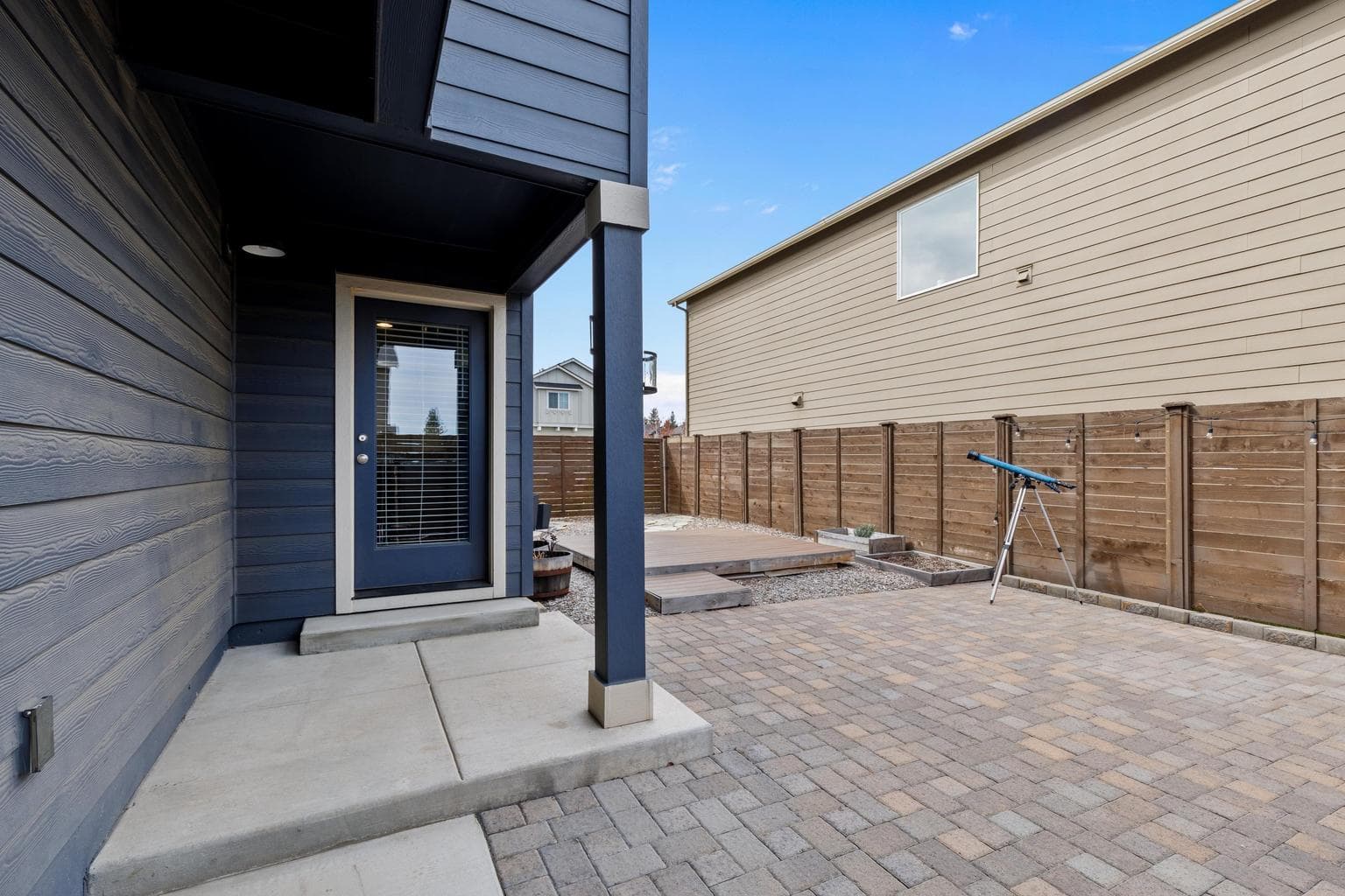 custom paver patio and raised deck