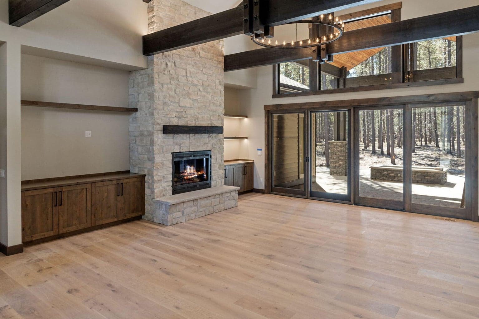 Grand vaulted ceilings with Pella large double sliding door to the exterior covered rear patio