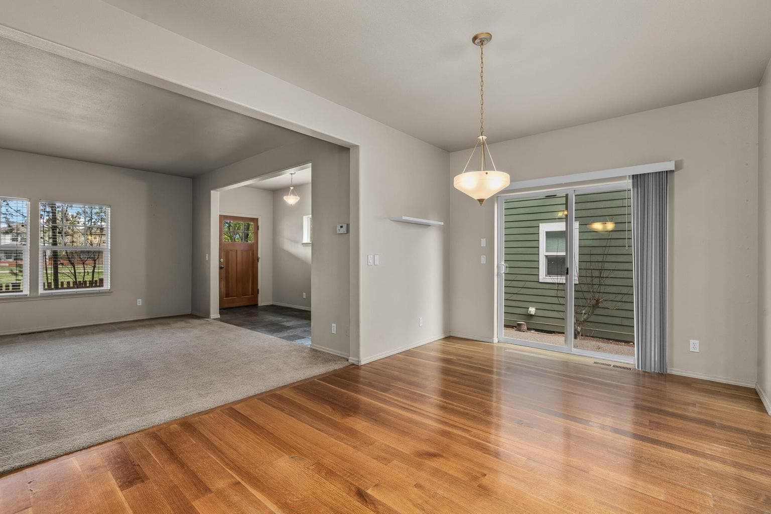 A perspective of the main floor showing the flow between the kitchen, dining, and living areas.