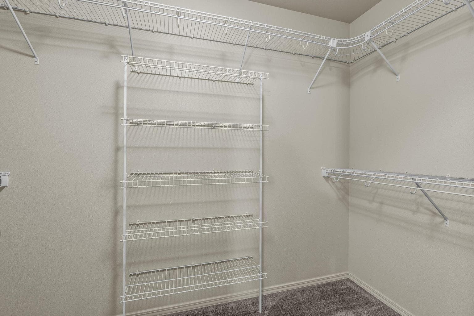 Walk-in closet with built-in storage.