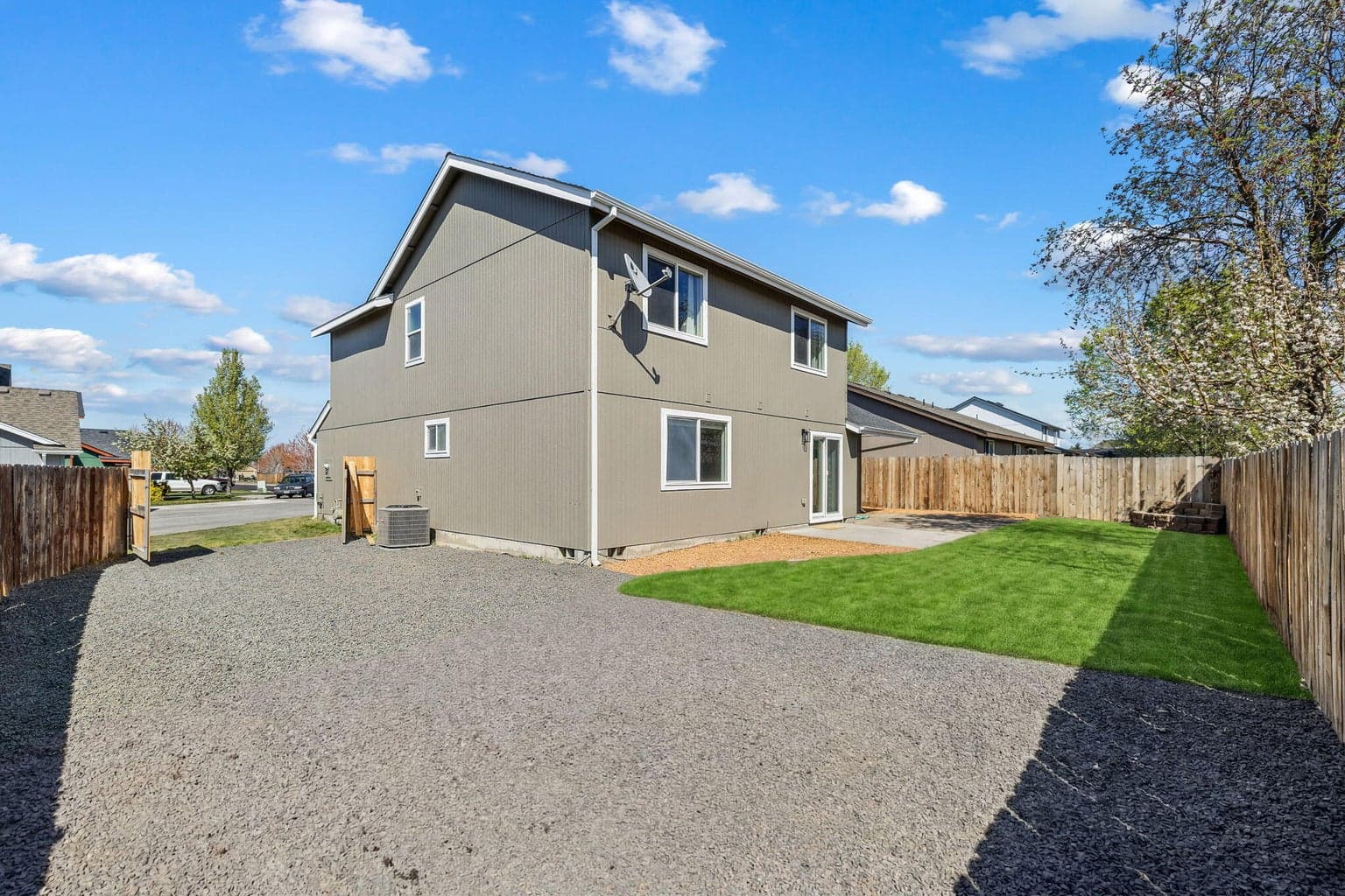 Fenced backyard with RV parking and gated.
