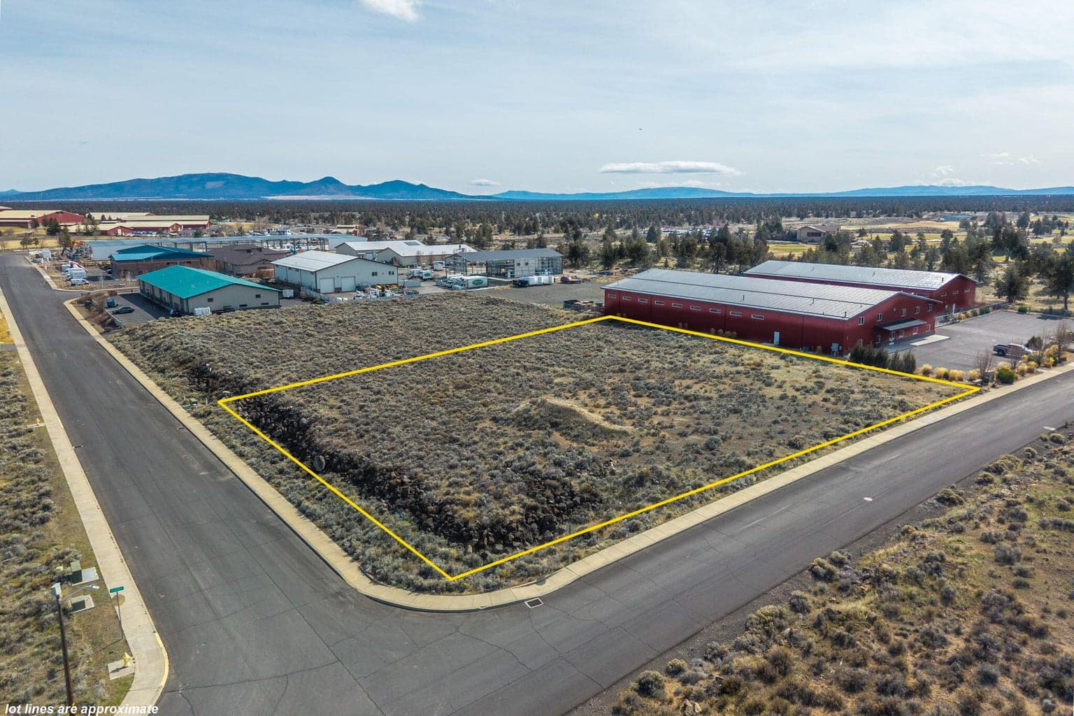 Street-level view of the 2.76-acre industrial lot at the corner of SW Deerhound and SW 23rd St.