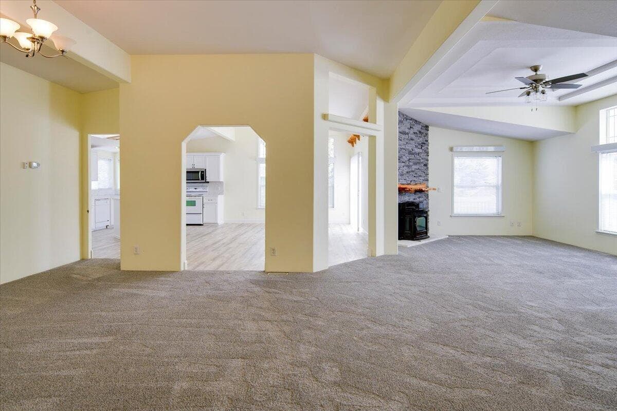 Living room flows seamlessly into the formal dining room